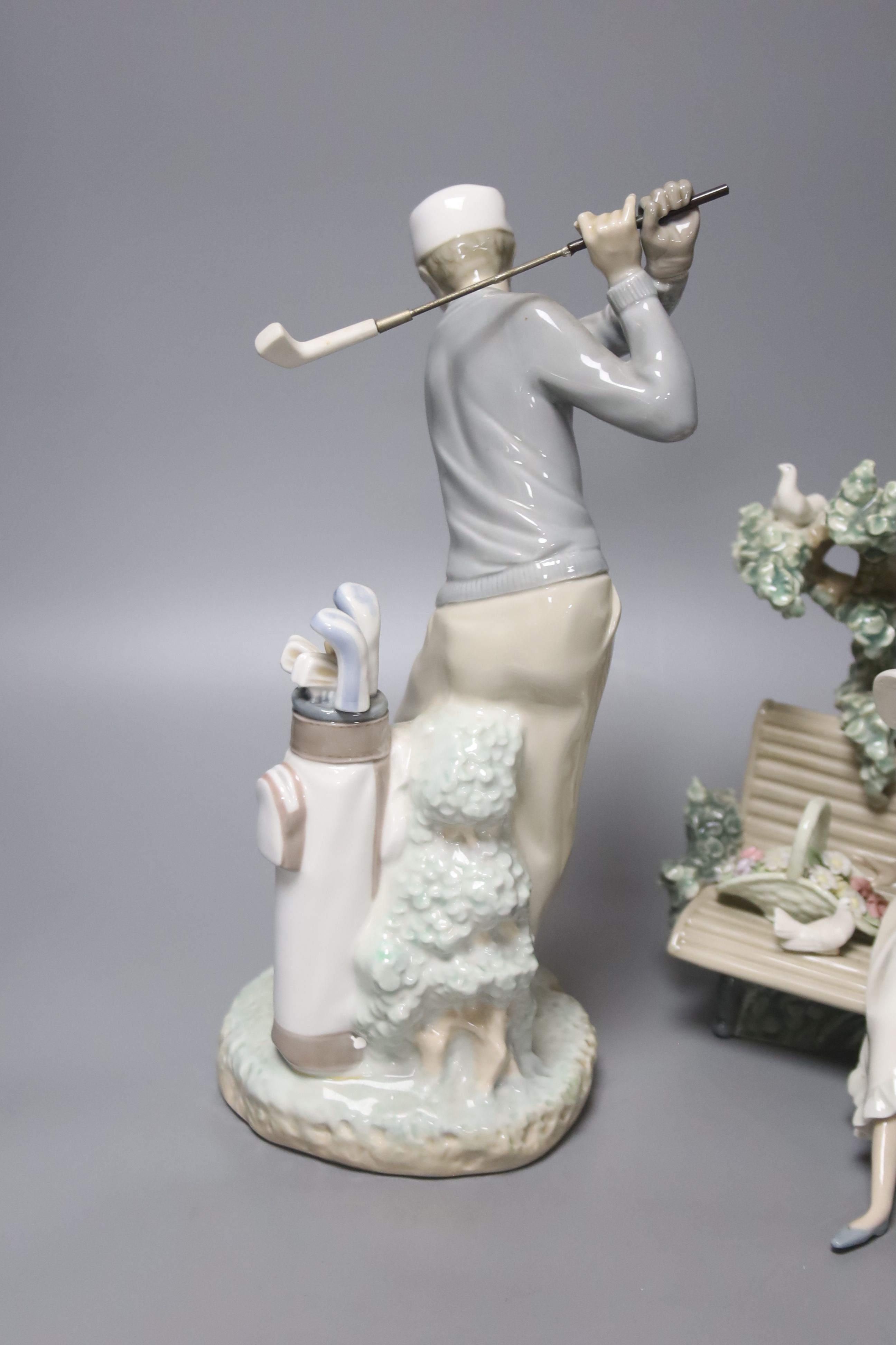 A Lladro figure, 'Sunday in the Park', no. 5365 and another 'Golfer', no. 4284 (2)